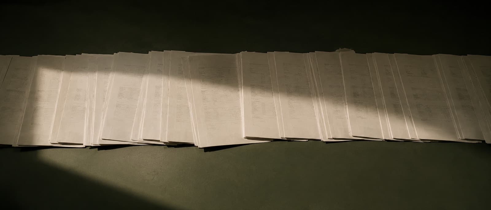 A long row of identical printed invoices spread edge to edge